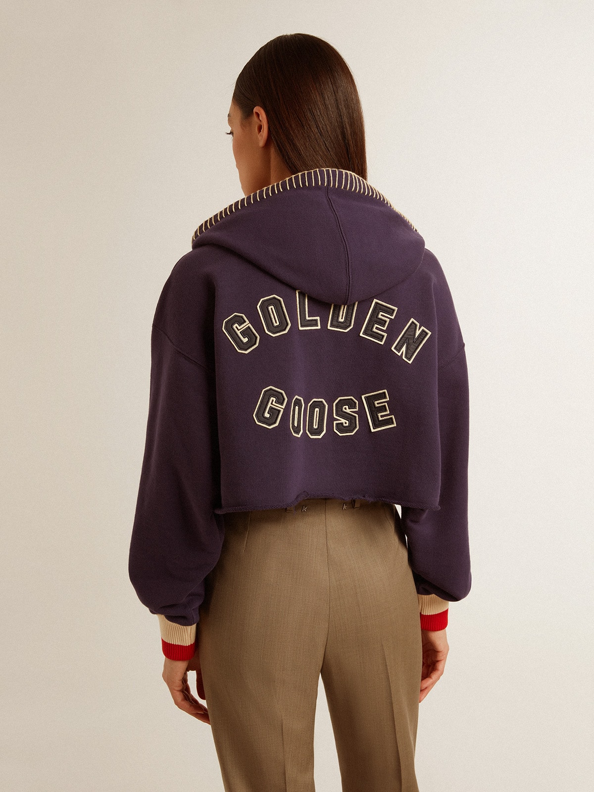 Dark blue cropped sweatshirt with zip fastening and embroidered hood