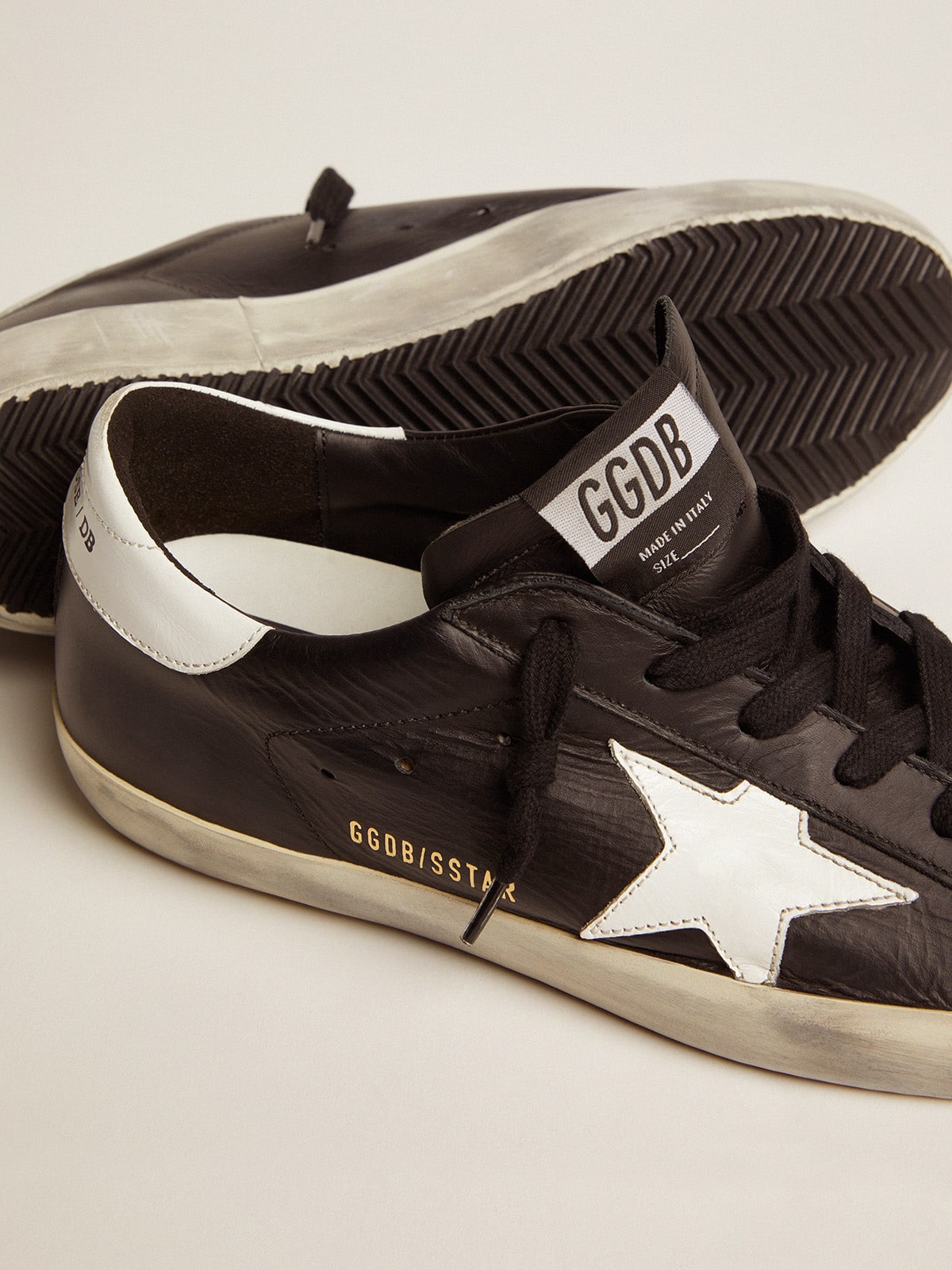 Women's Super-Star in black leather with white leather star and heel tab
