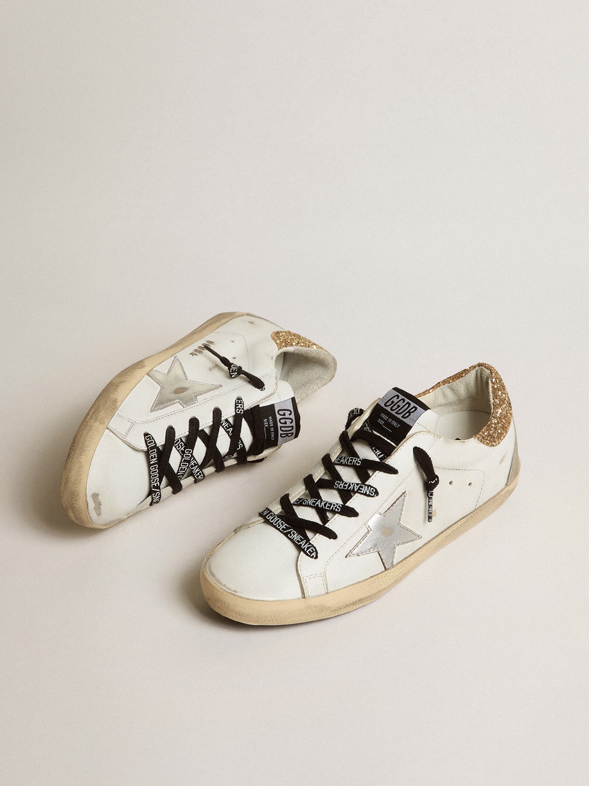 Women's white leather Super-Star with glittery heel tab