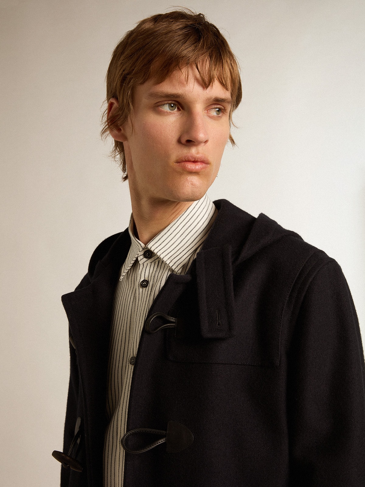 Dark blue wool duffle coat with hood and toggle fastening
