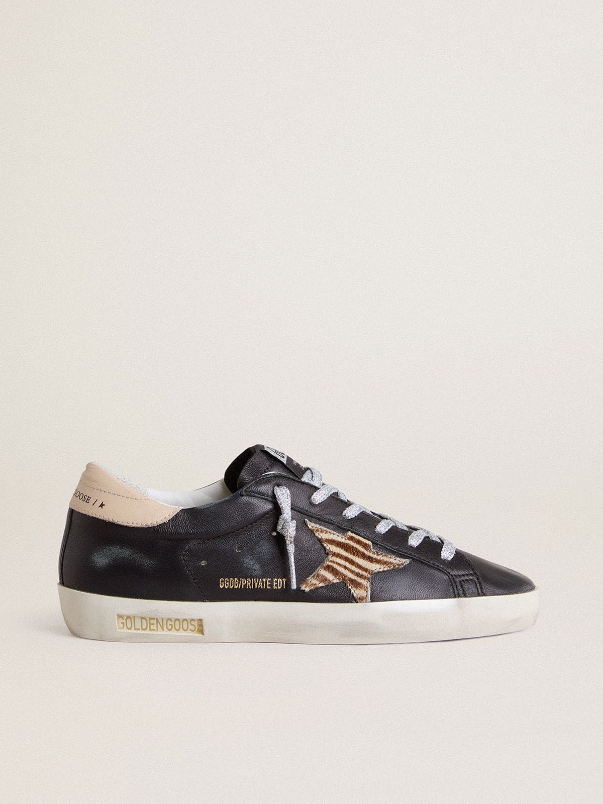 Women's Super-Star in black nappa leather with zebra-print pony skin star and beige leather heel tab