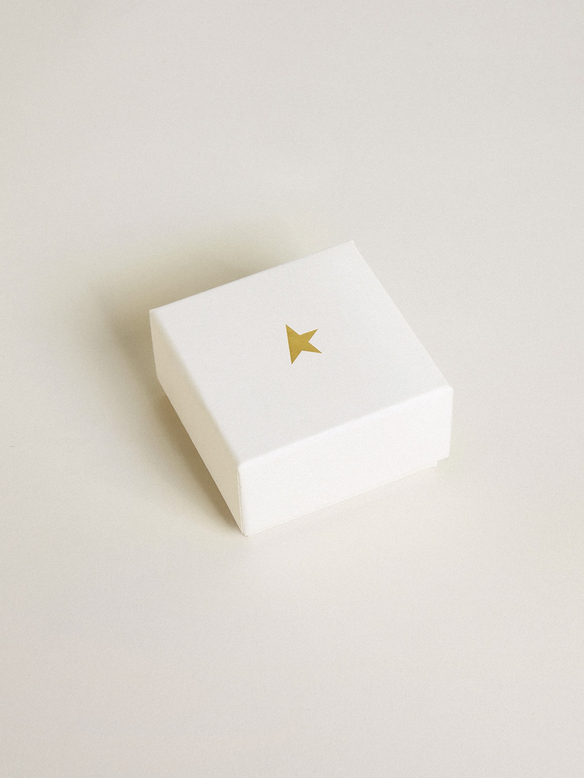 Lock-shaped charm in gold-colored brass with crystals