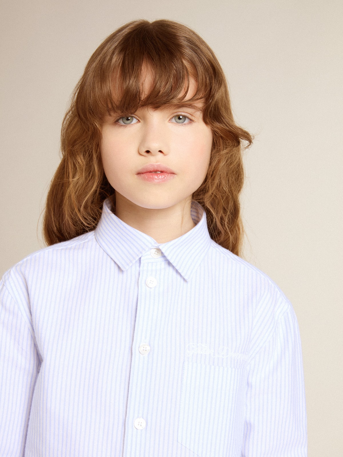 Girls' striped shirt with embroidered lettering on the pocket