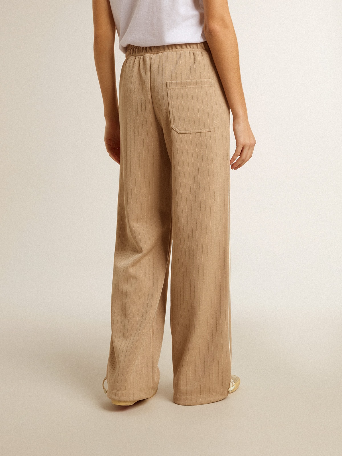 Women's light beige joggers with white logo