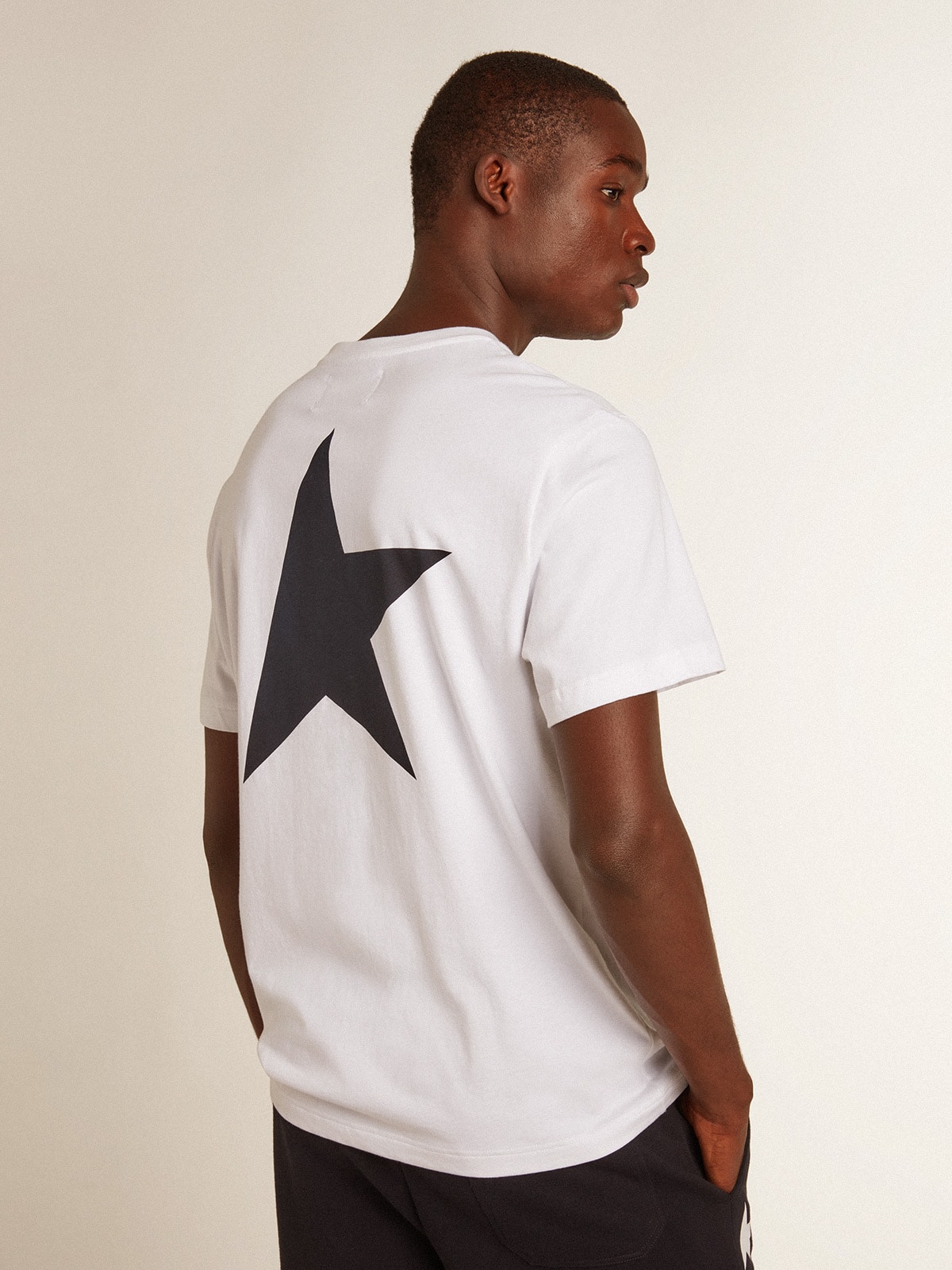 Men's white T-shirt with dark blue star on the back