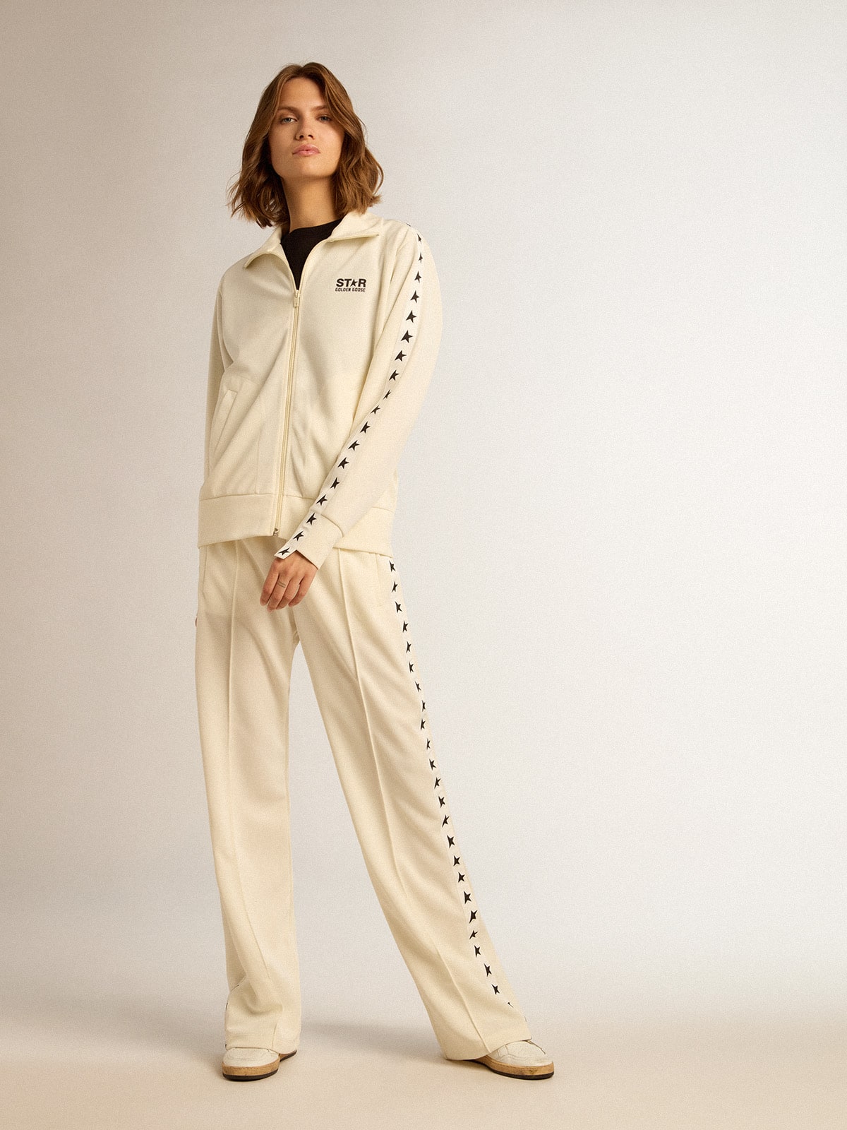 Women's white zipped sweatshirt with white strip and black stars
