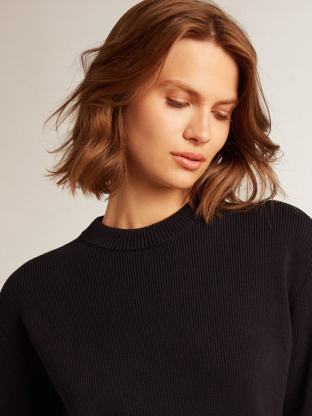 Women's round-neck sweater in dark blue cotton with logo on the back