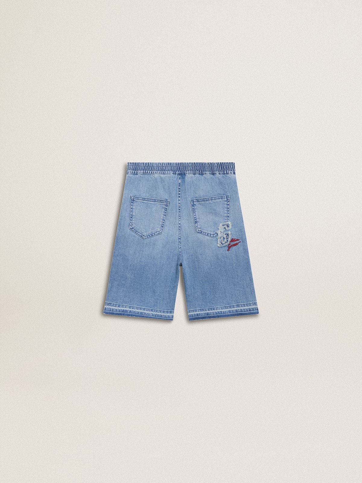 Kids' denim shorts with embroidery on the back