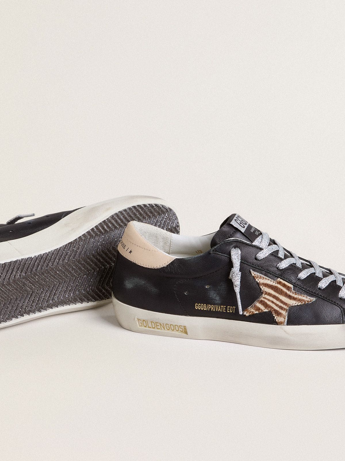 Women's Super-Star in black nappa leather with zebra-print pony skin star and beige leather heel tab