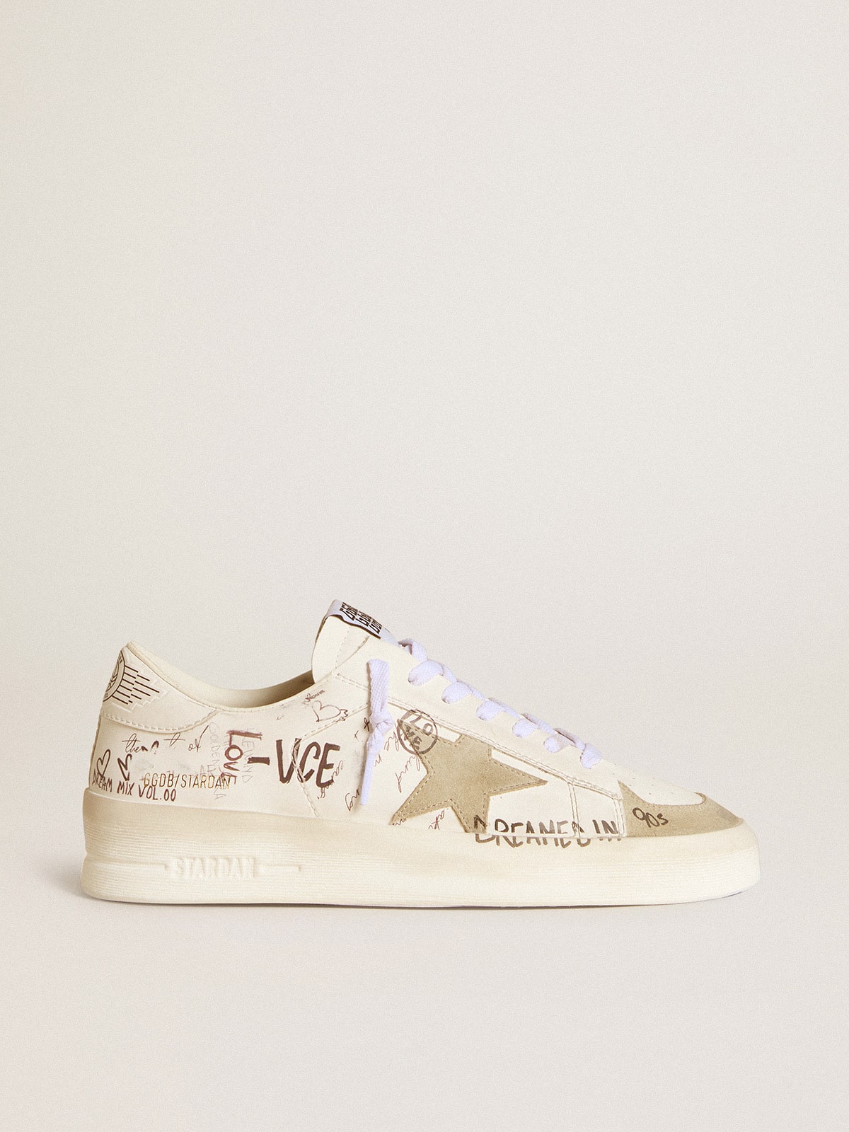 Stardan with beige suede star and toe and all-over lettering and patterns