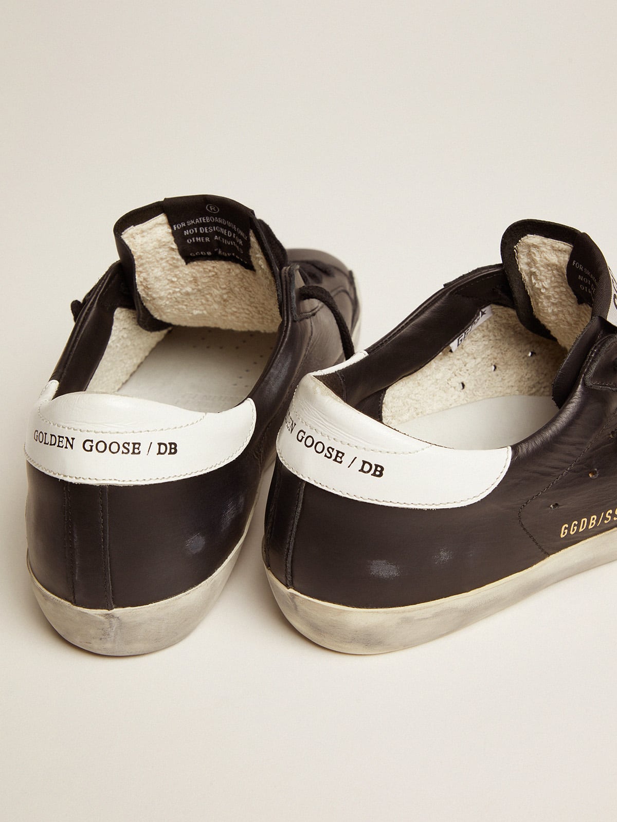 Women's Super-Star in black leather with white leather star and heel tab