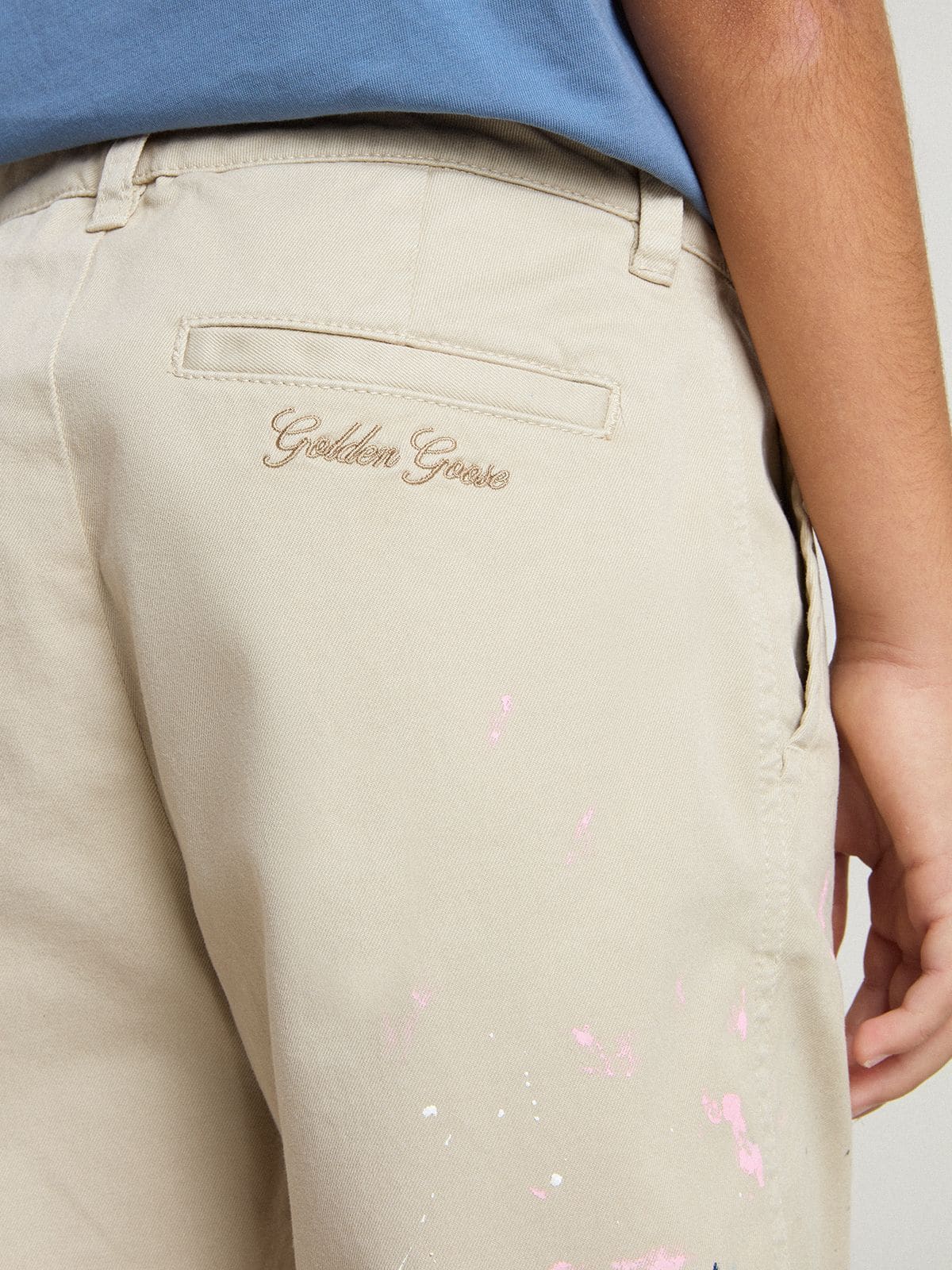 Kids' beige chino pants with multicolor splashes