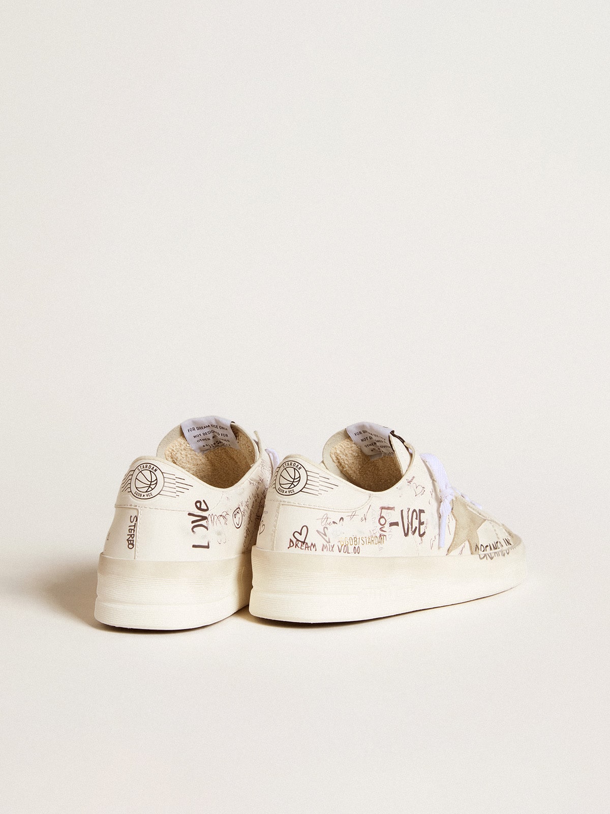 Stardan with beige suede star and toe and all-over lettering and patterns
