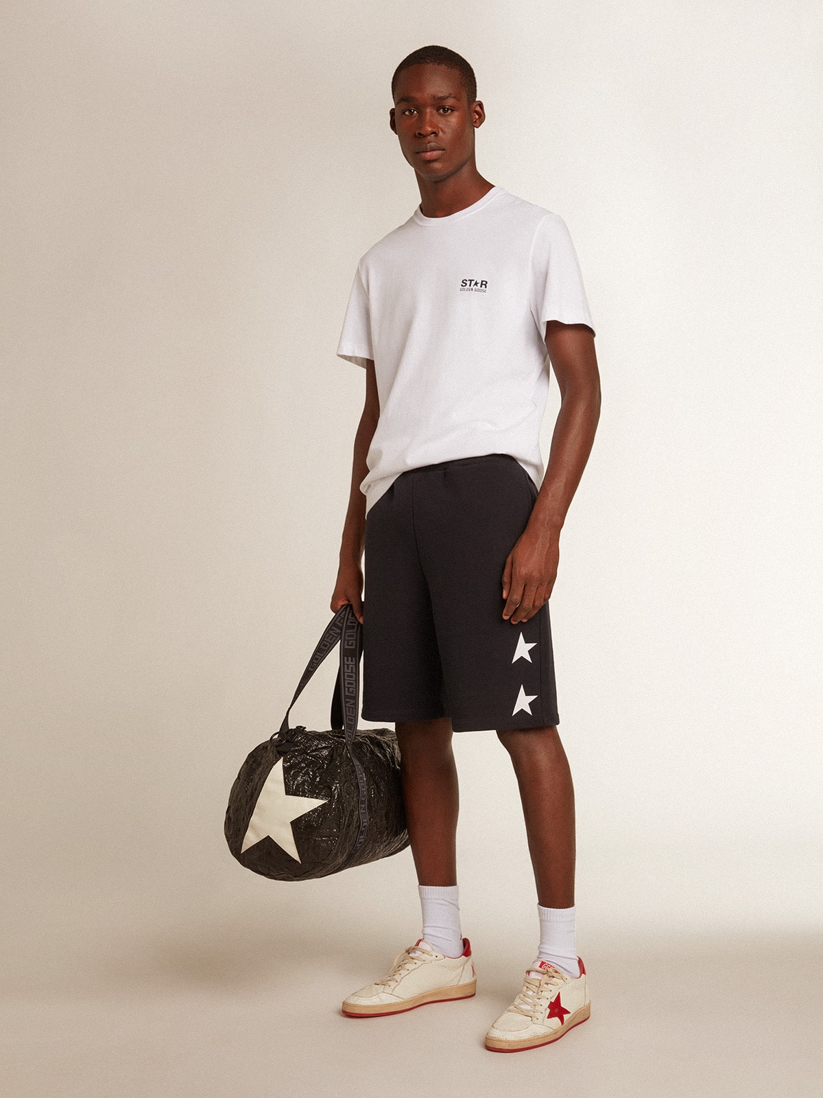 Men's white T-shirt with dark blue star on the back