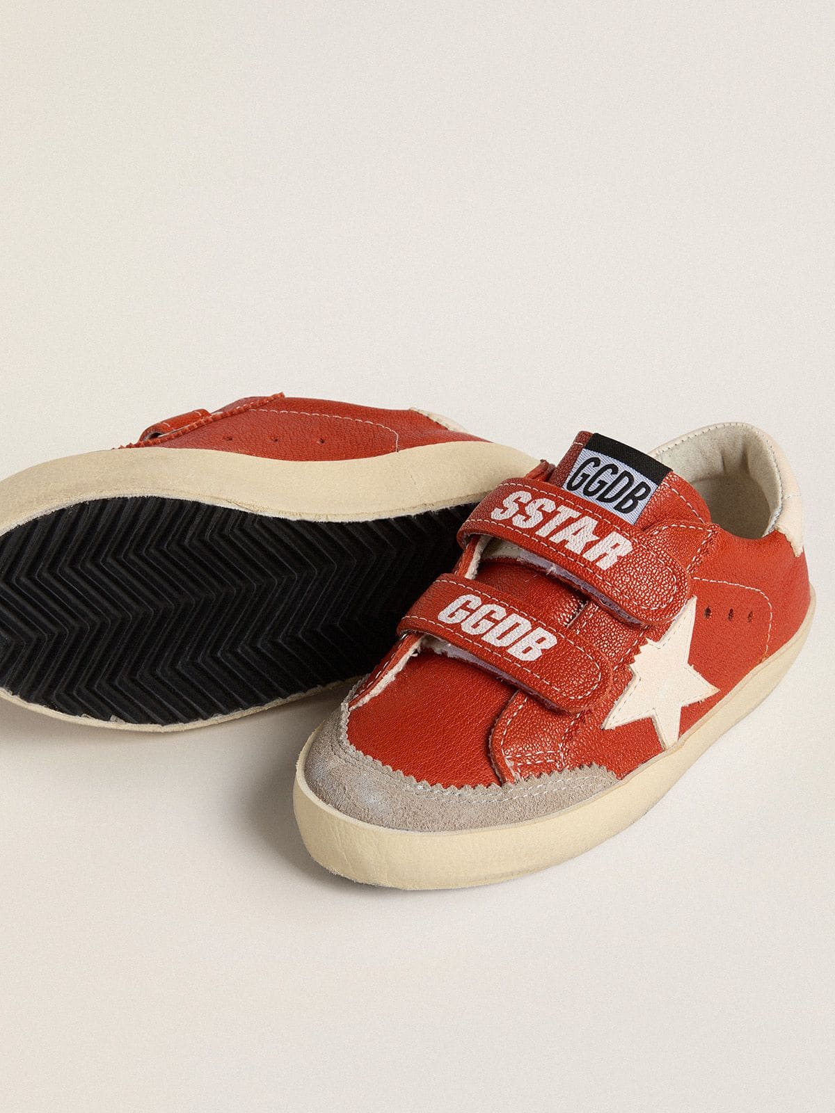 Young Old School in orange nappa with white star and cream-colored leather heel tab