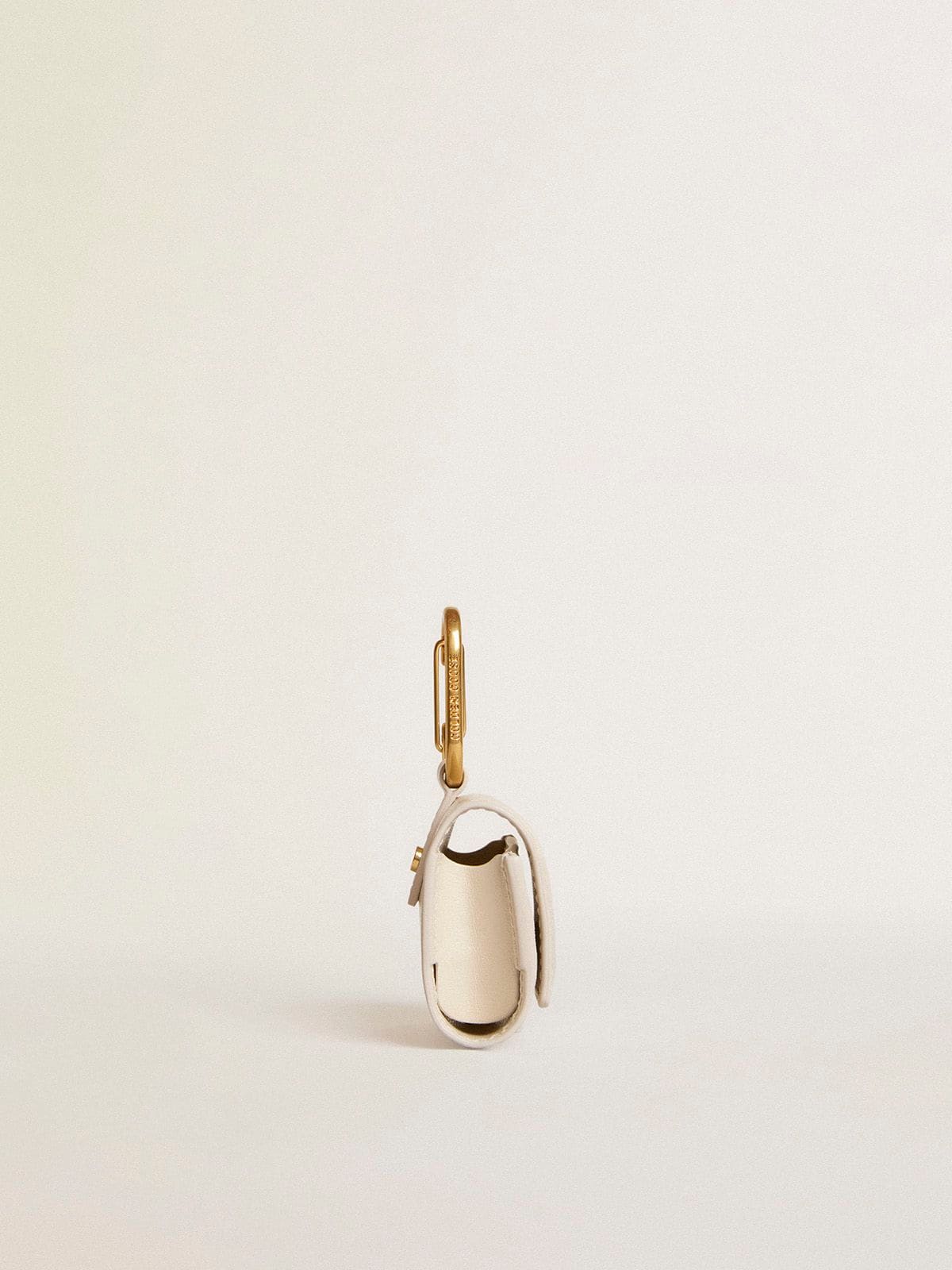 Worn white AirPod case
