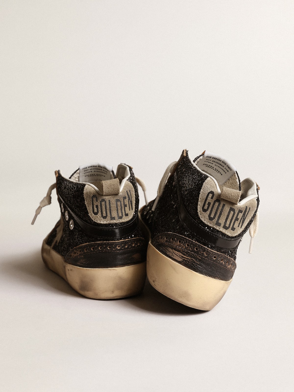 Women's Mid Star in black glitter with dove-gray suede star and heel tab