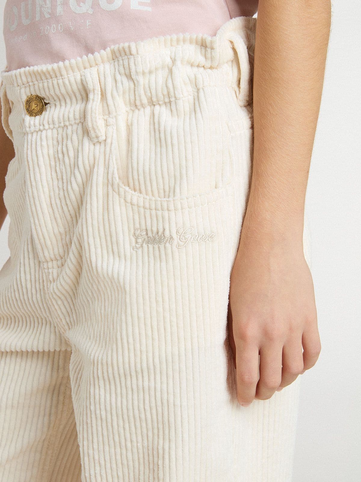 Girls' wide ribbed cream-colored trousers with embroidery