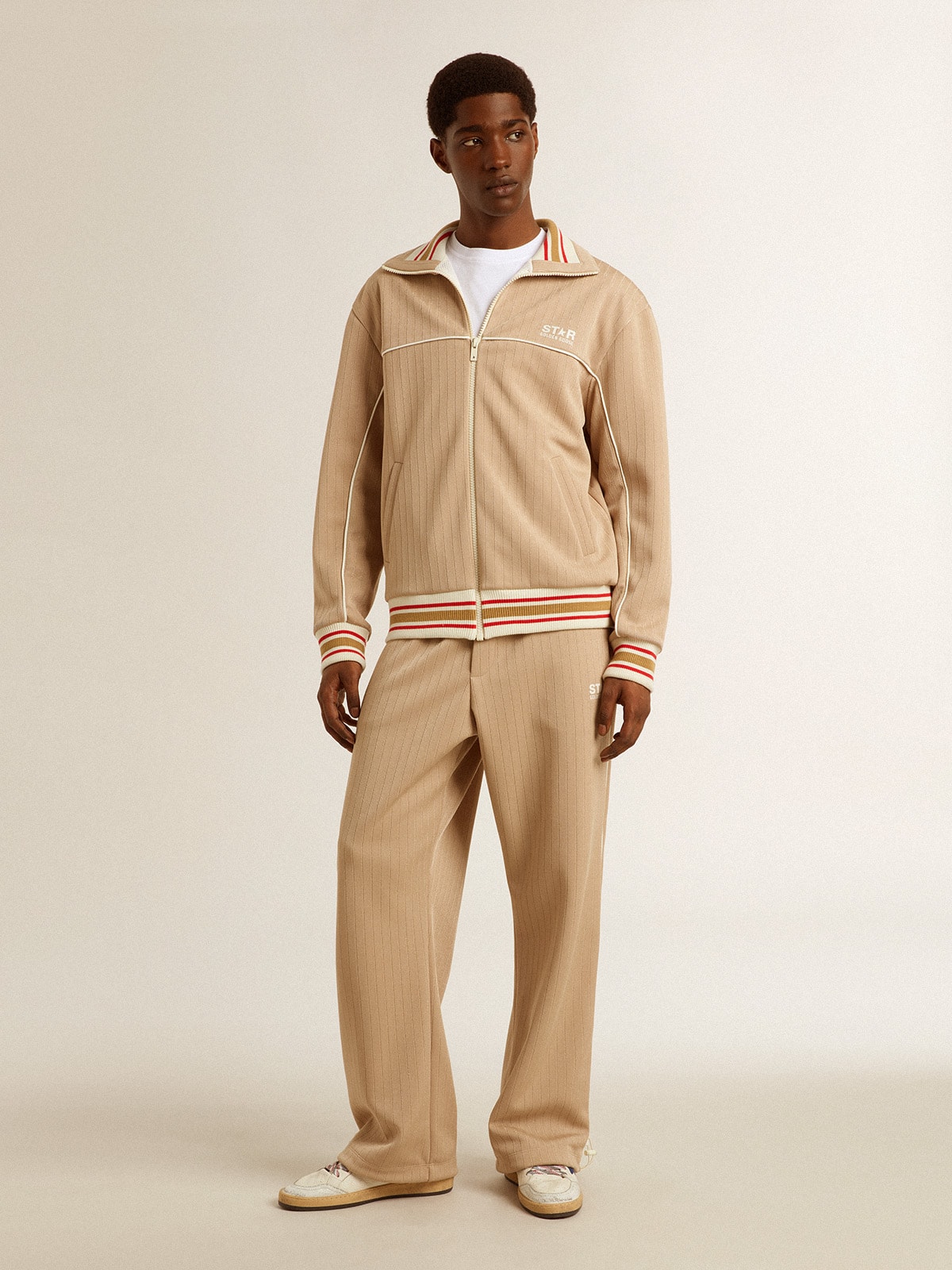 Men's light beige joggers with white logo