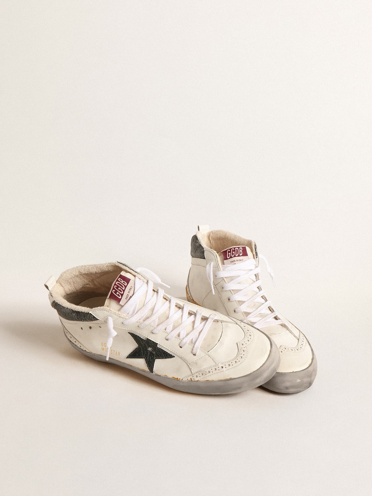 Mid Star with green metallic leather star and white flash