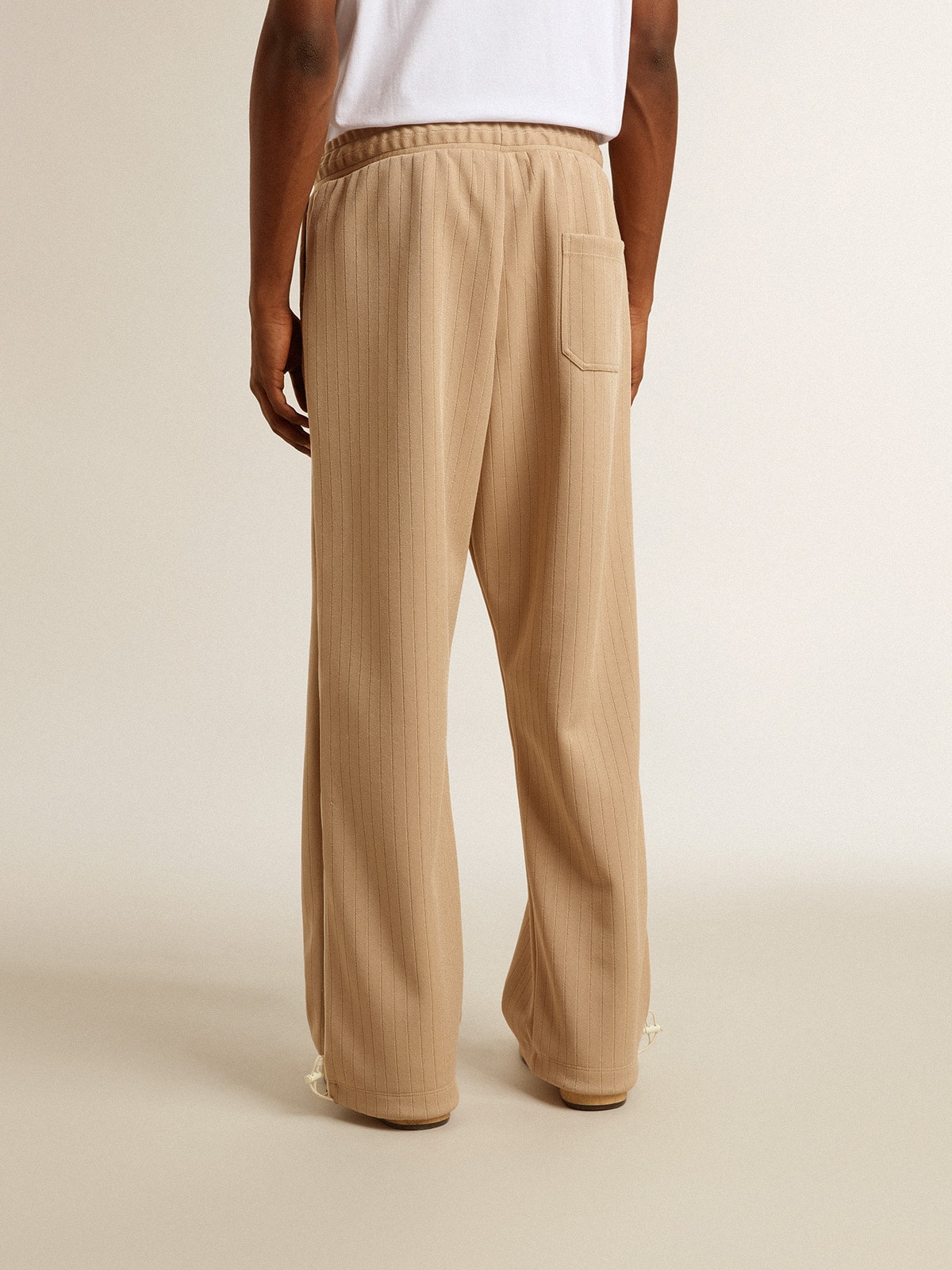 Men's light beige joggers with white logo