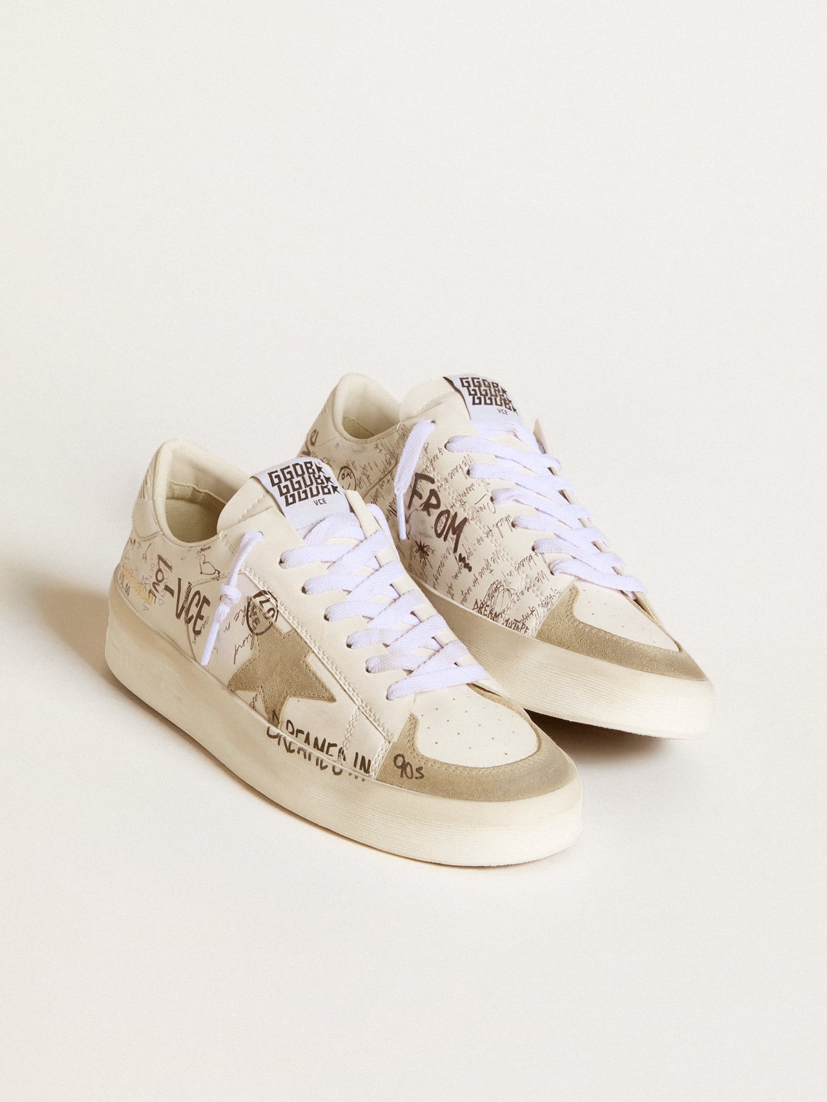 Stardan with beige suede star and toe and all-over lettering and patterns