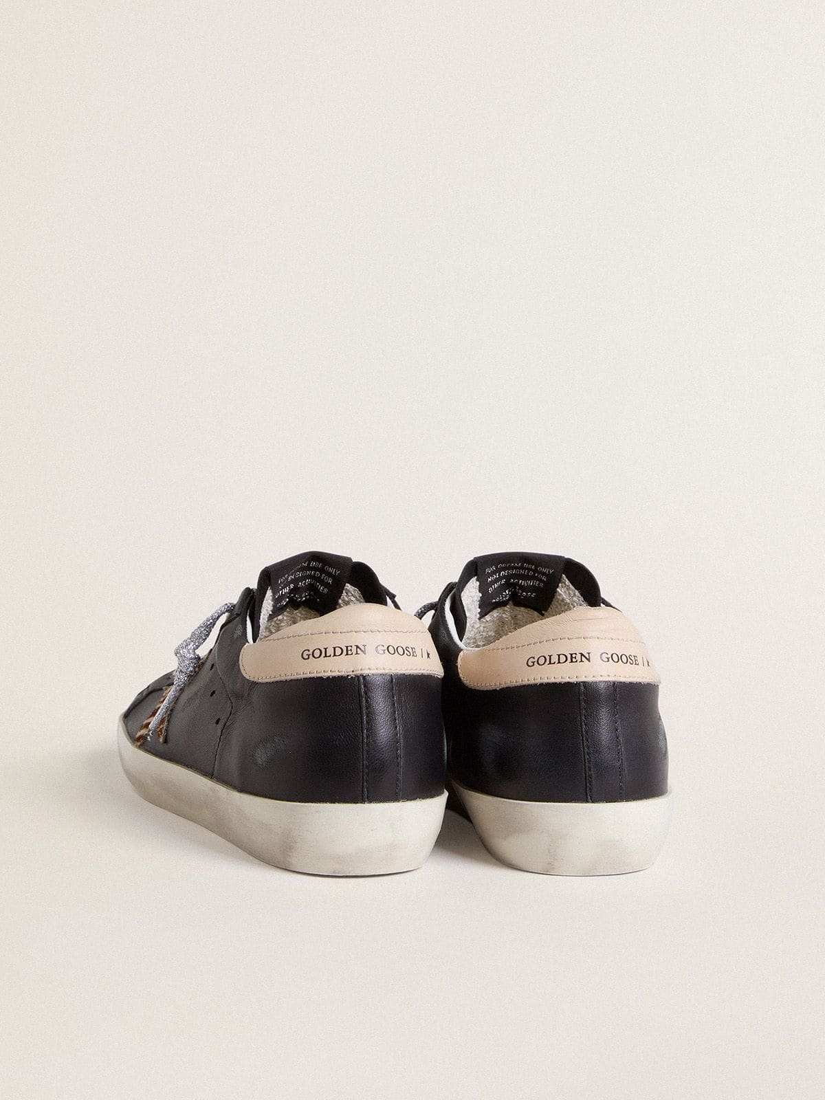 Women's Super-Star in black nappa leather with zebra-print pony skin star and beige leather heel tab