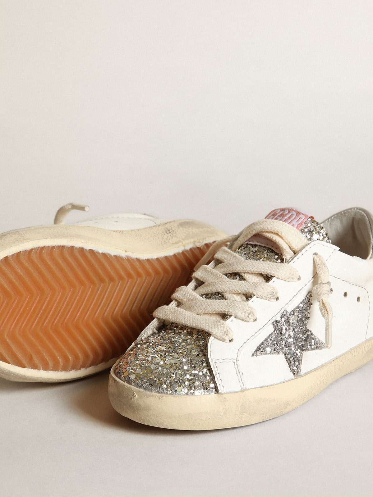 Young Super-Star with silver glitter star and platinum tongue