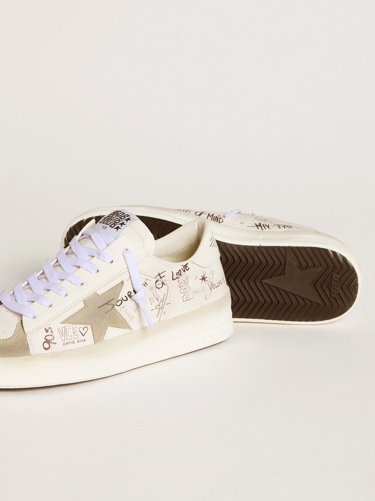 Stardan with beige suede star and toe and all-over lettering and patterns