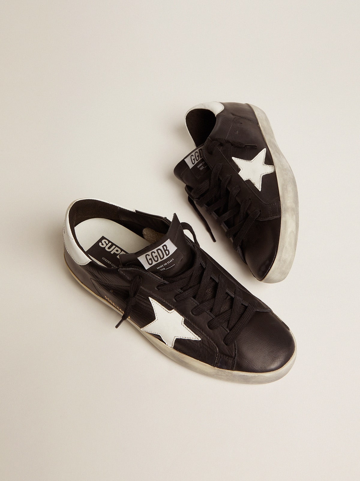Women's Super-Star in black leather with white leather star and heel tab