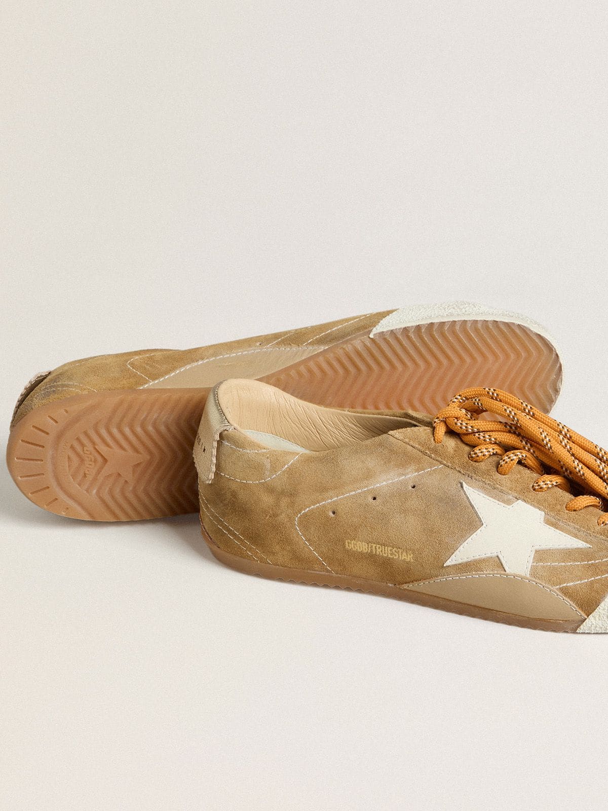 Men's True-Star in tobacco-colored suede with white star and platinum heel tab