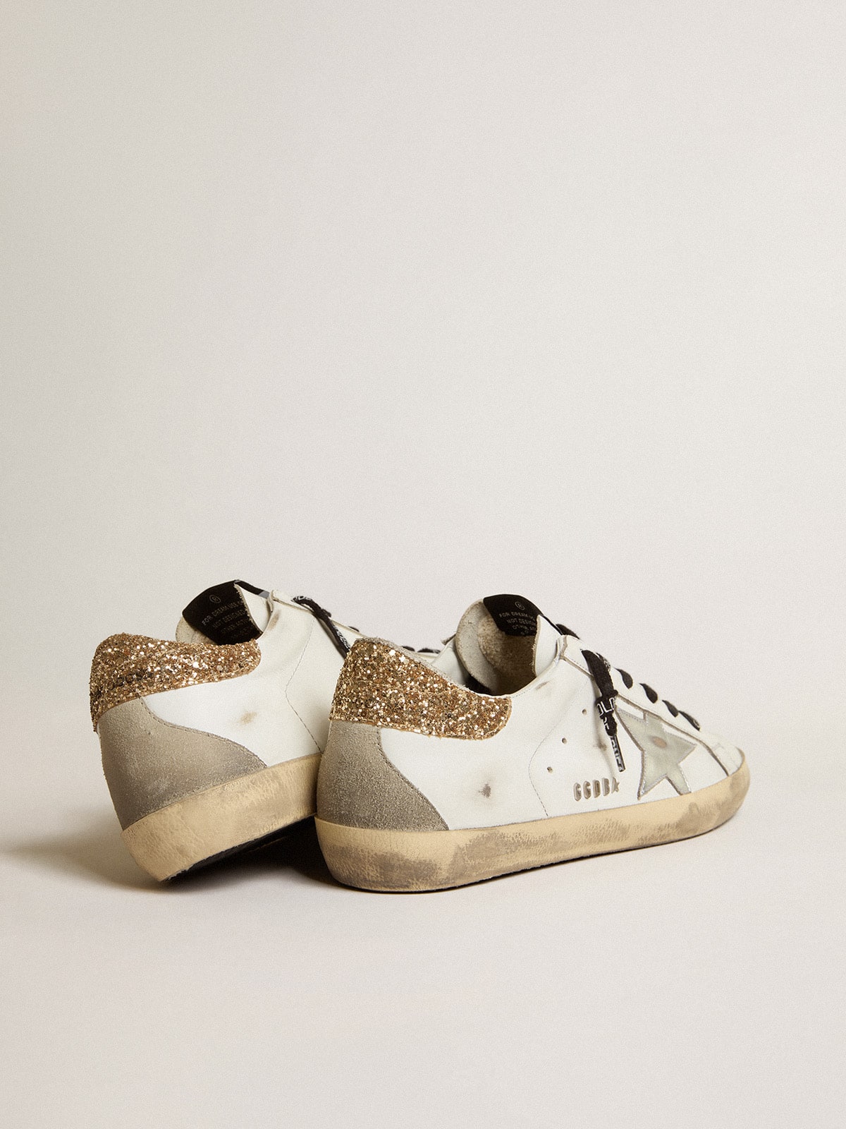 Women's white leather Super-Star with glittery heel tab