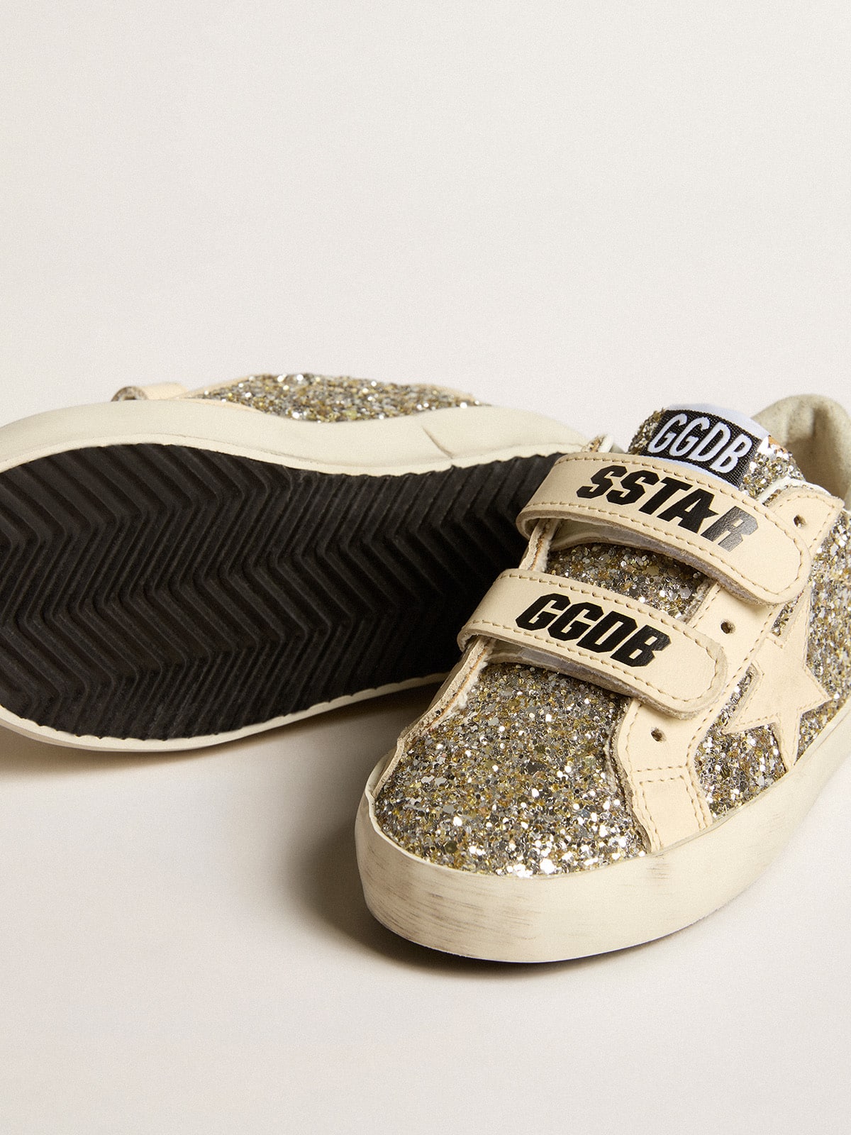 Old School Young in platinum glitter with leather star and heel tab