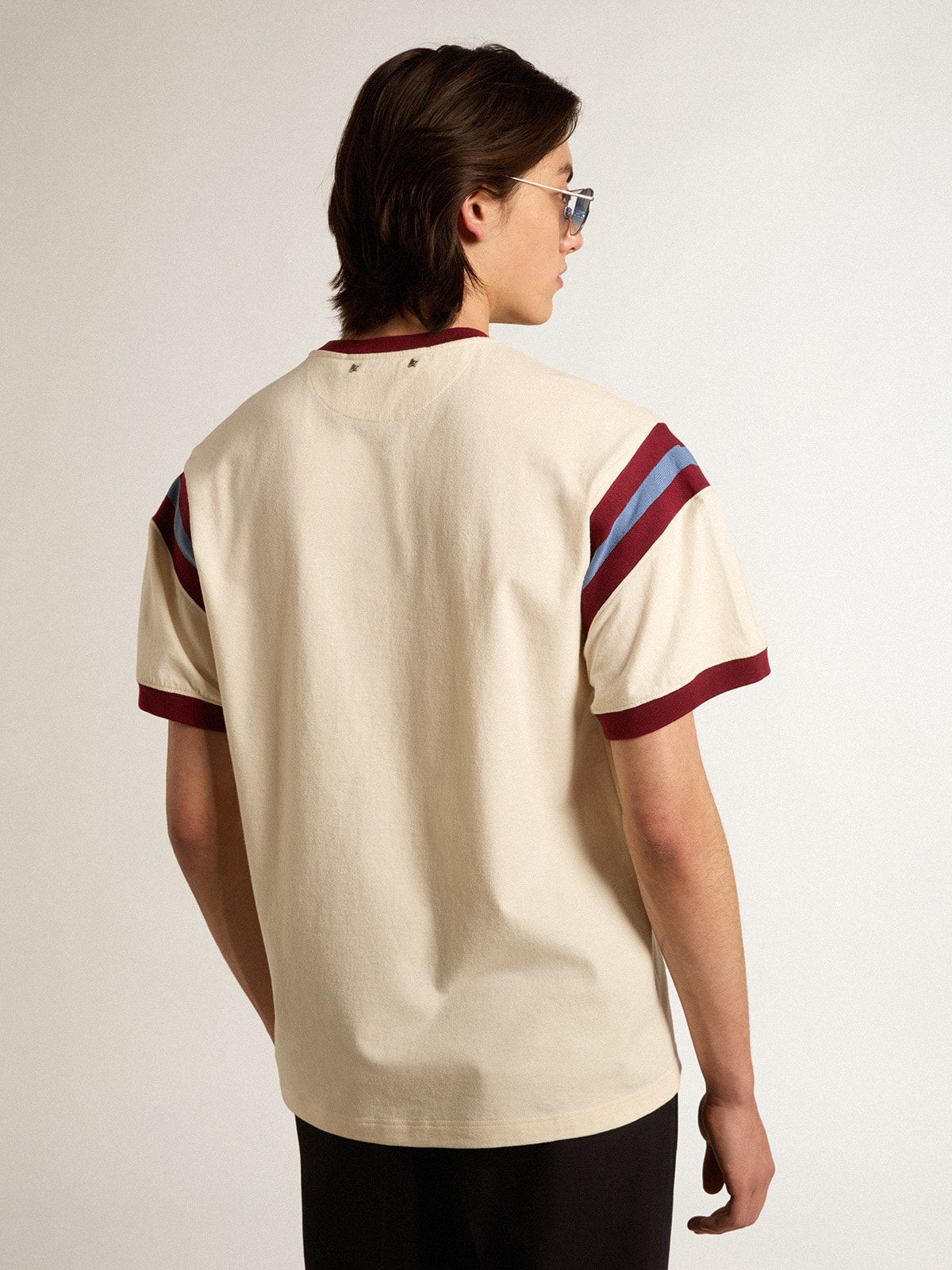 Men's white T-shirt with burgundy lettering on the front
