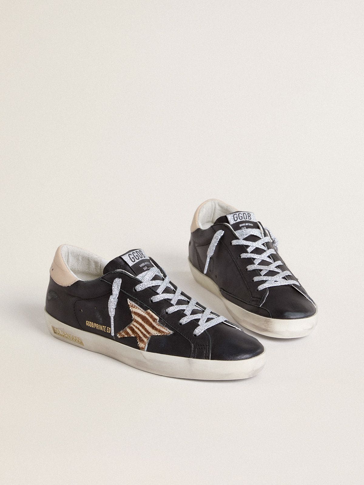 Women's Super-Star in black nappa leather with zebra-print pony skin star and beige leather heel tab
