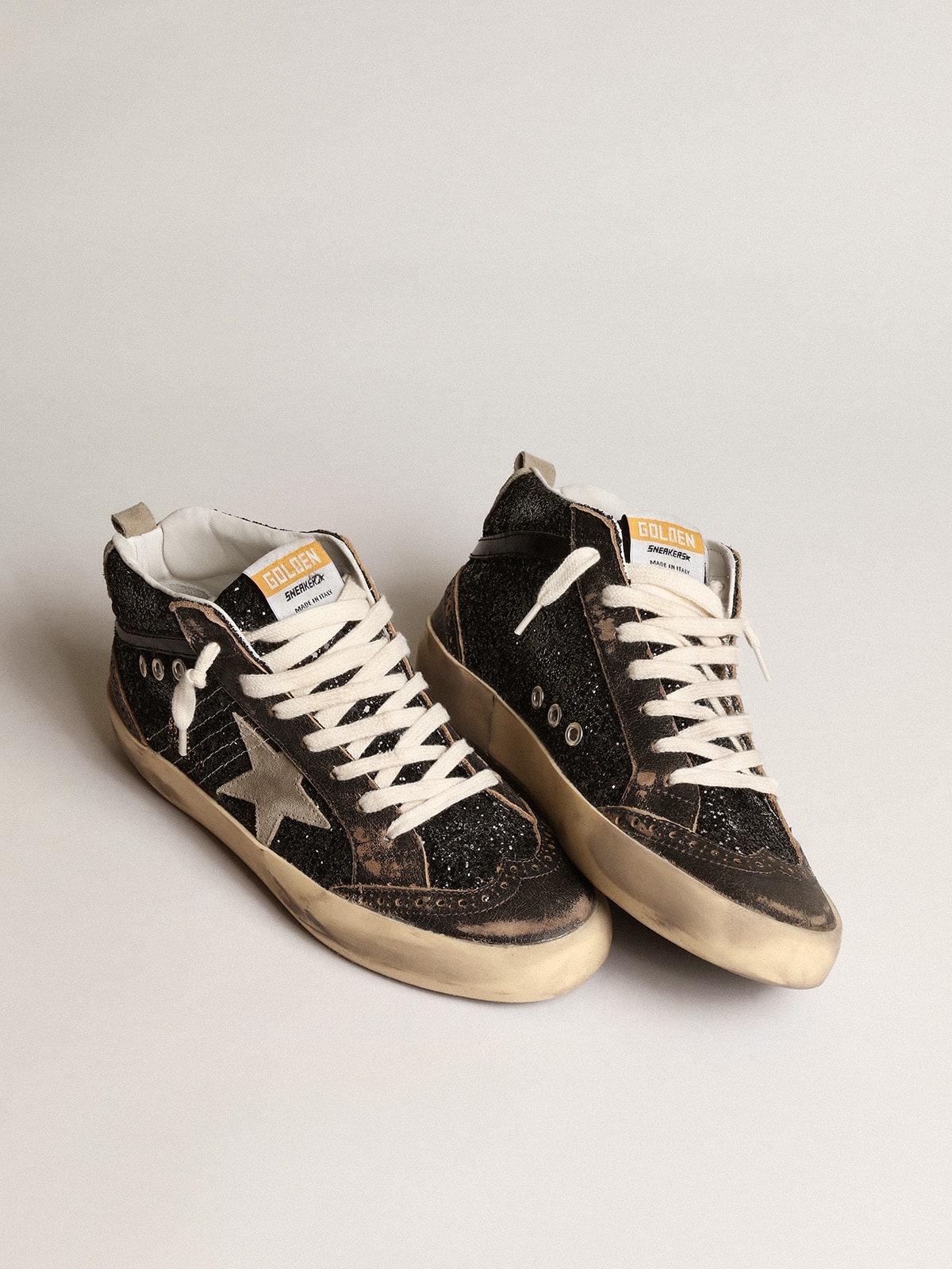 Women's Mid Star in black glitter with dove-gray suede star and heel tab