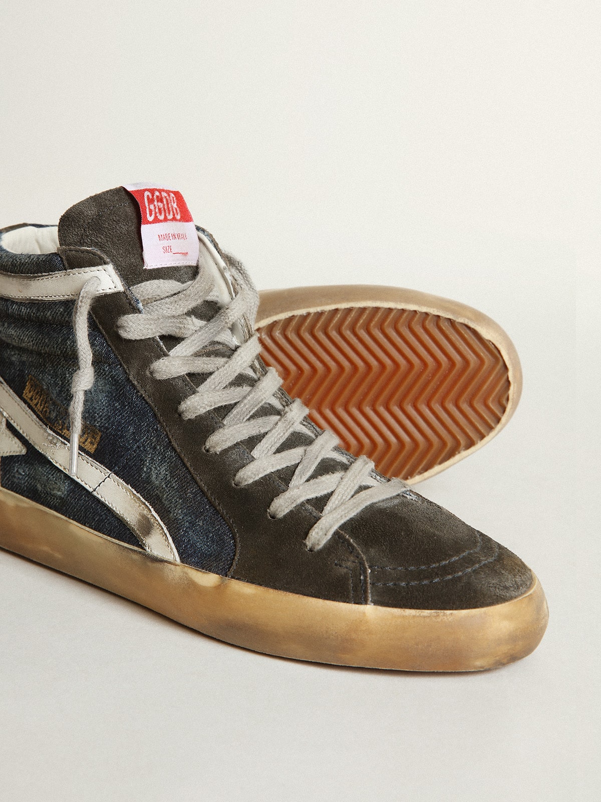 Slide in midnight-blue denim with white leather star
