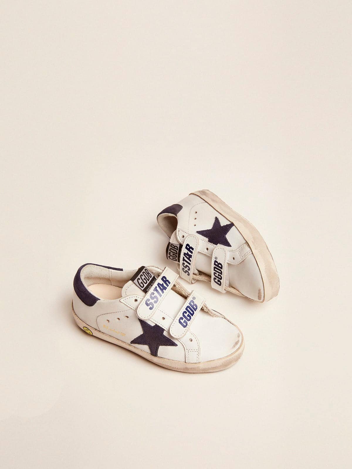 Old School Junior in white leather with blue suede star and heel tab