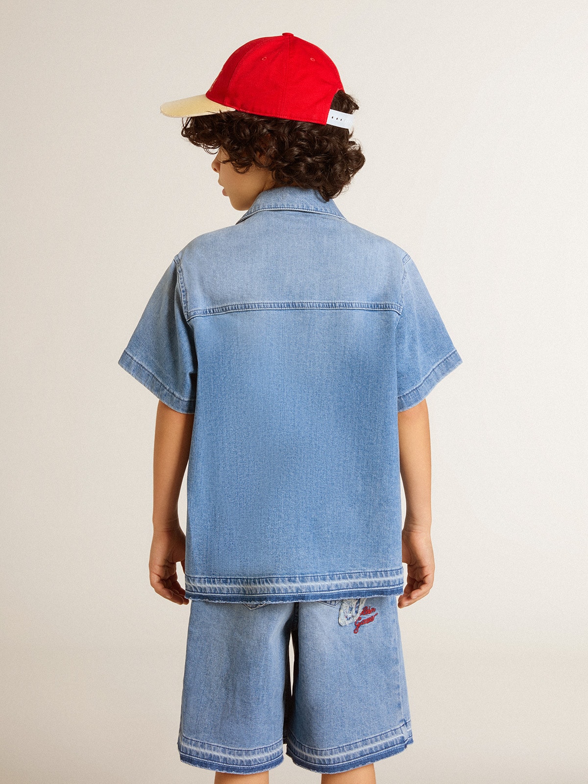 Kids' denim shorts with embroidery on the back