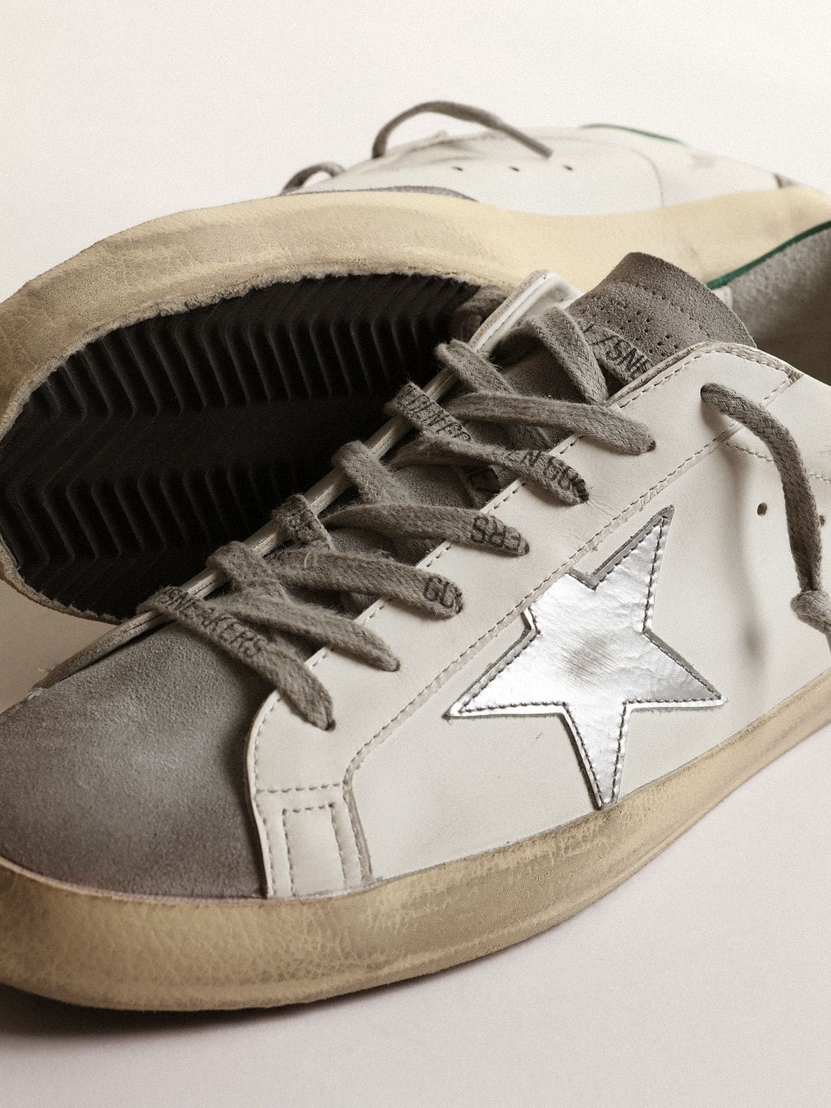 Men's Super-Star in white leather with silver star and green heel tab