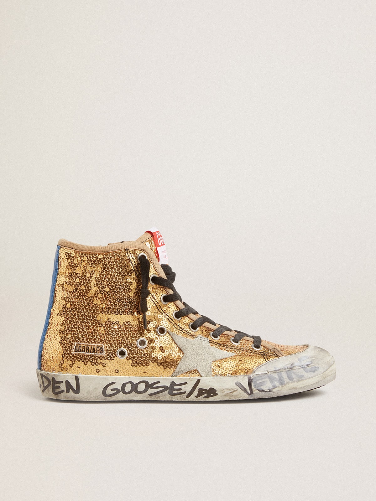 Francy Penstar in gold paiettes with suede star and bright blue heel tab