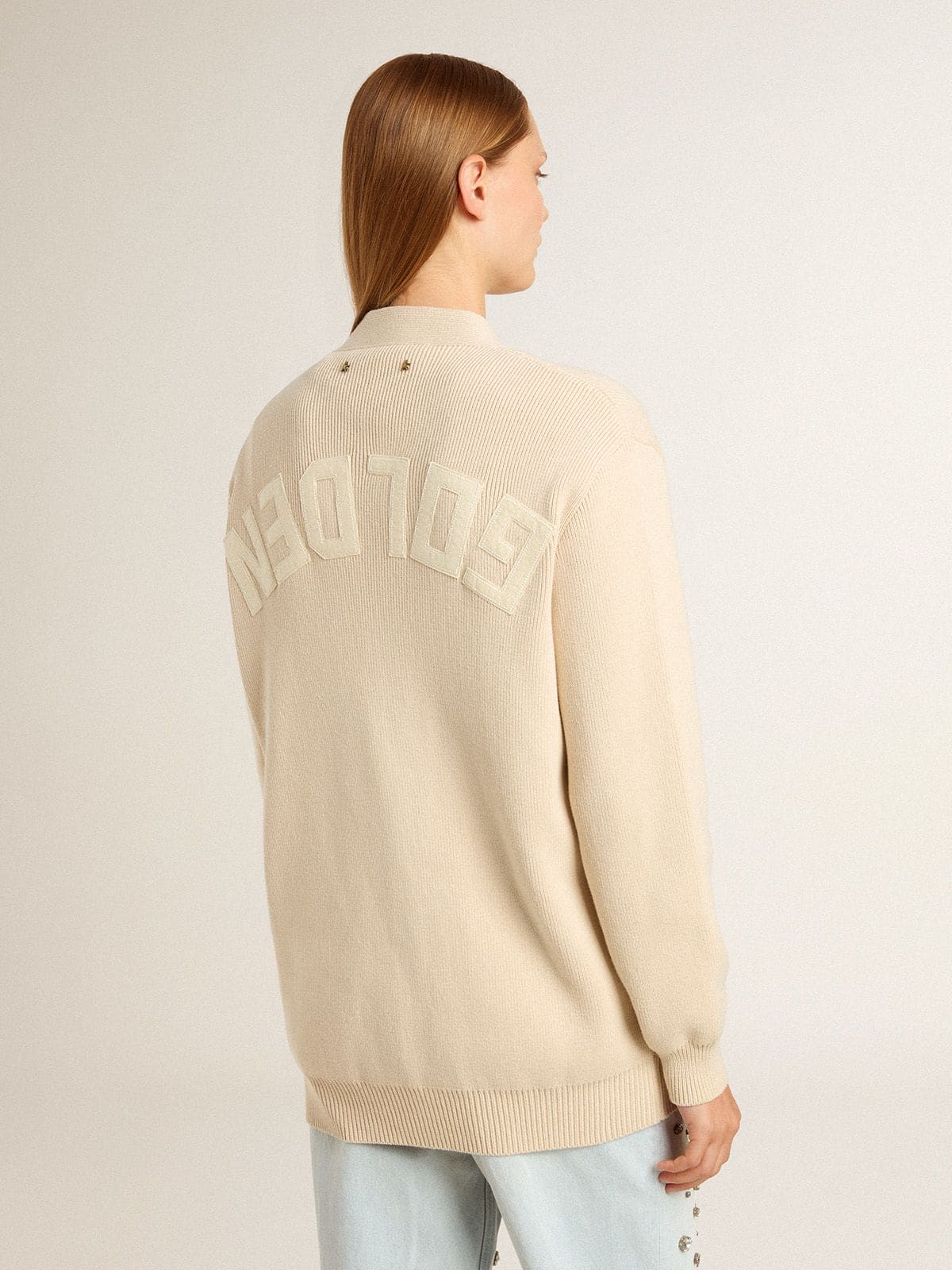 Women's beige cardigan with 'Golden' lettering on the back