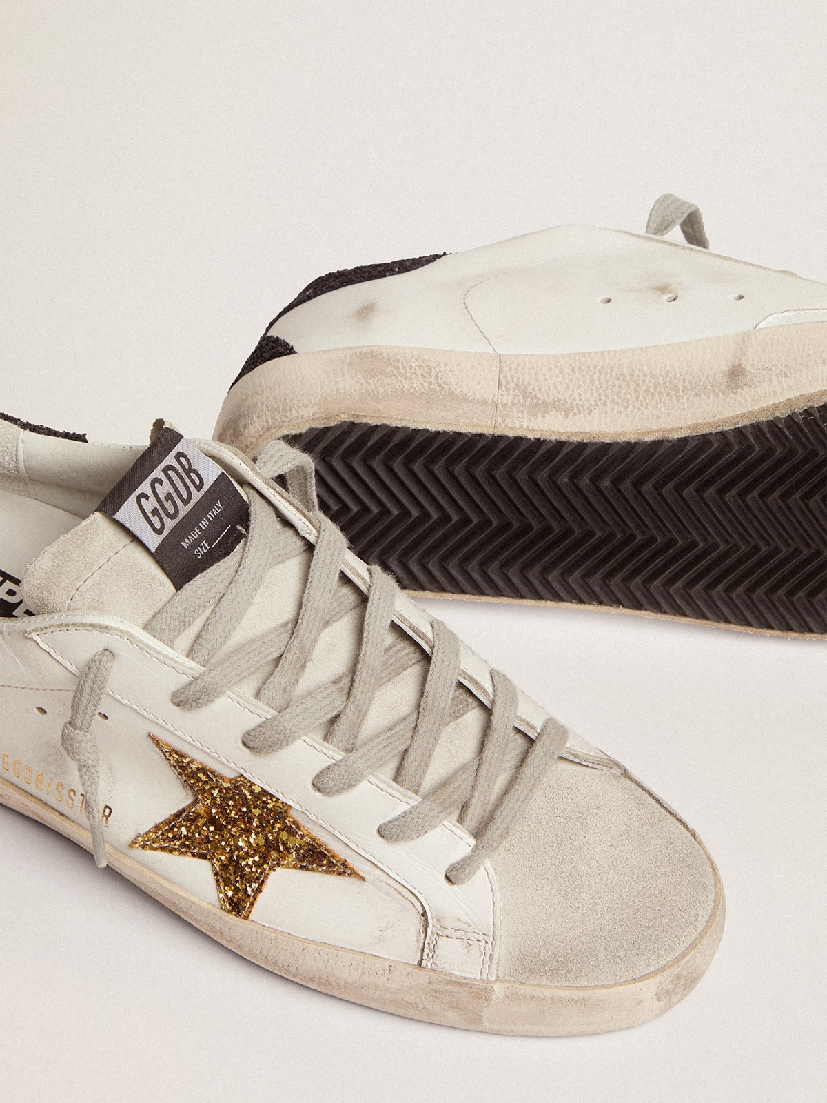 Women's Super-Star in nappa leather with gold glitter star and black glitter heel tab