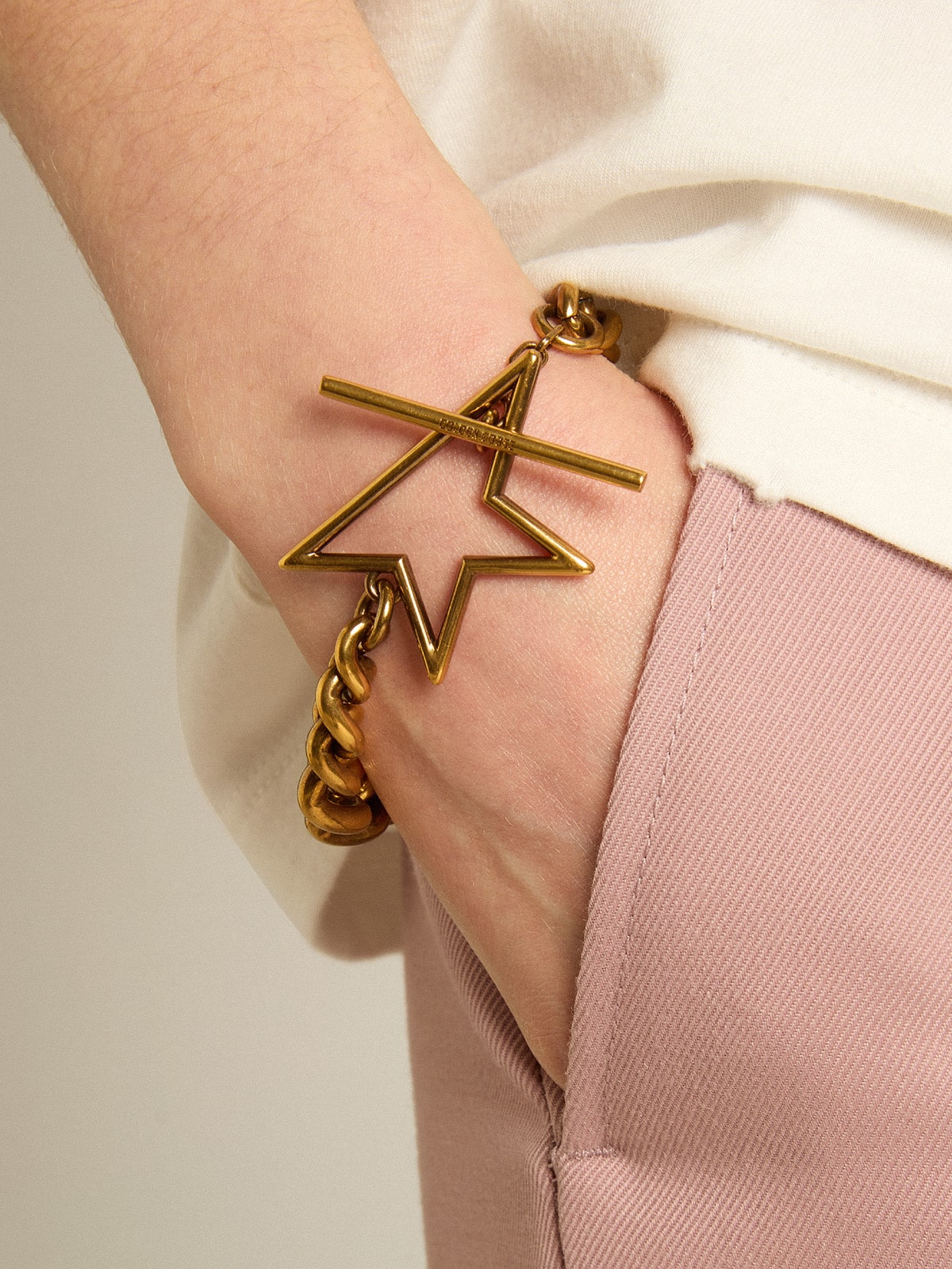 Bracelet in antique gold decreasing chain with star-shaped clasp