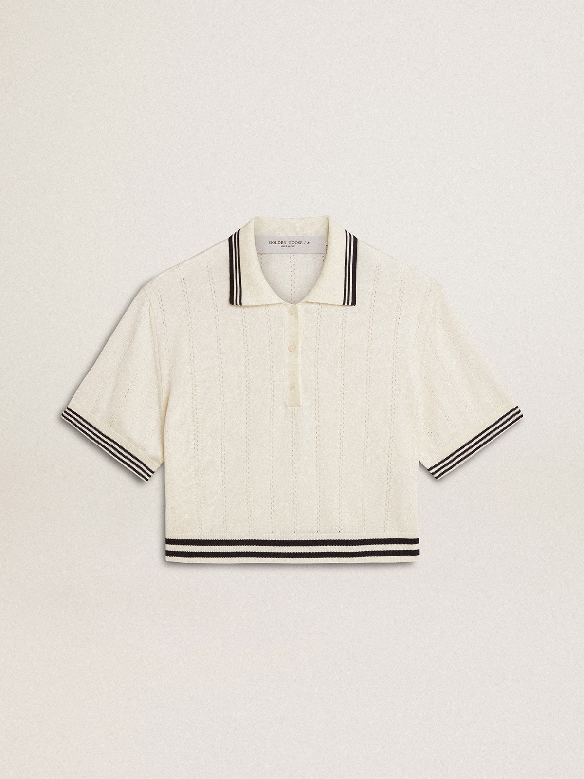 Women's cropped worn-white cotton polo shirt with blue ribbing