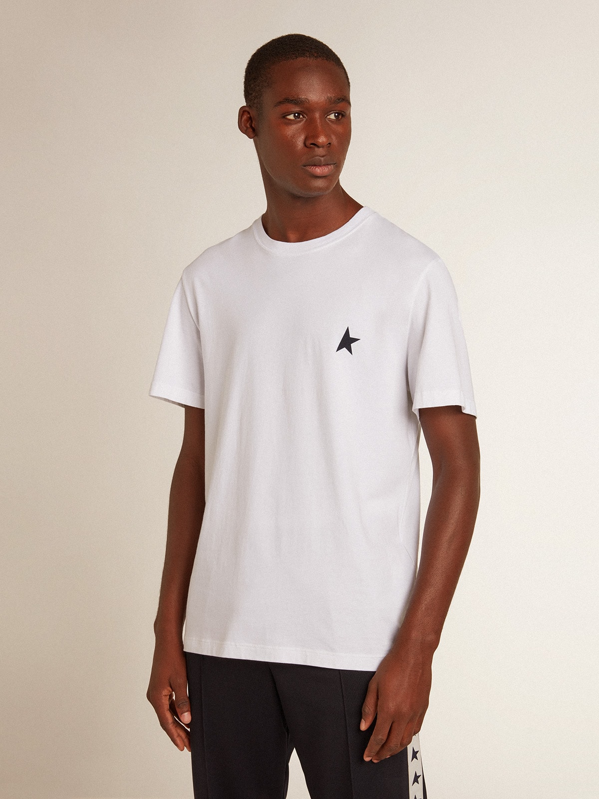 Men's white T-shirt with dark blue star on the front