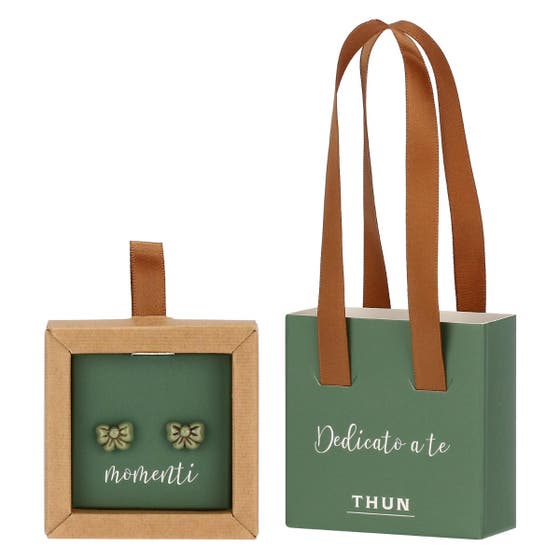 Pin earrings with green bow