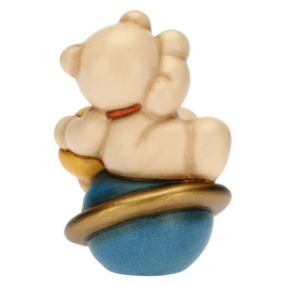 Teddy astronaut on planet