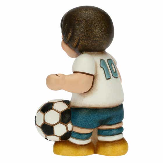 Boy footballer playing with ball