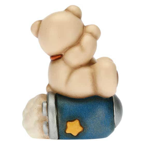 Teddy astronaut on rocket